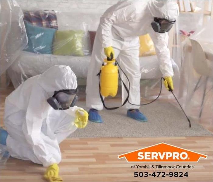 A home is being sanitized by technicians.